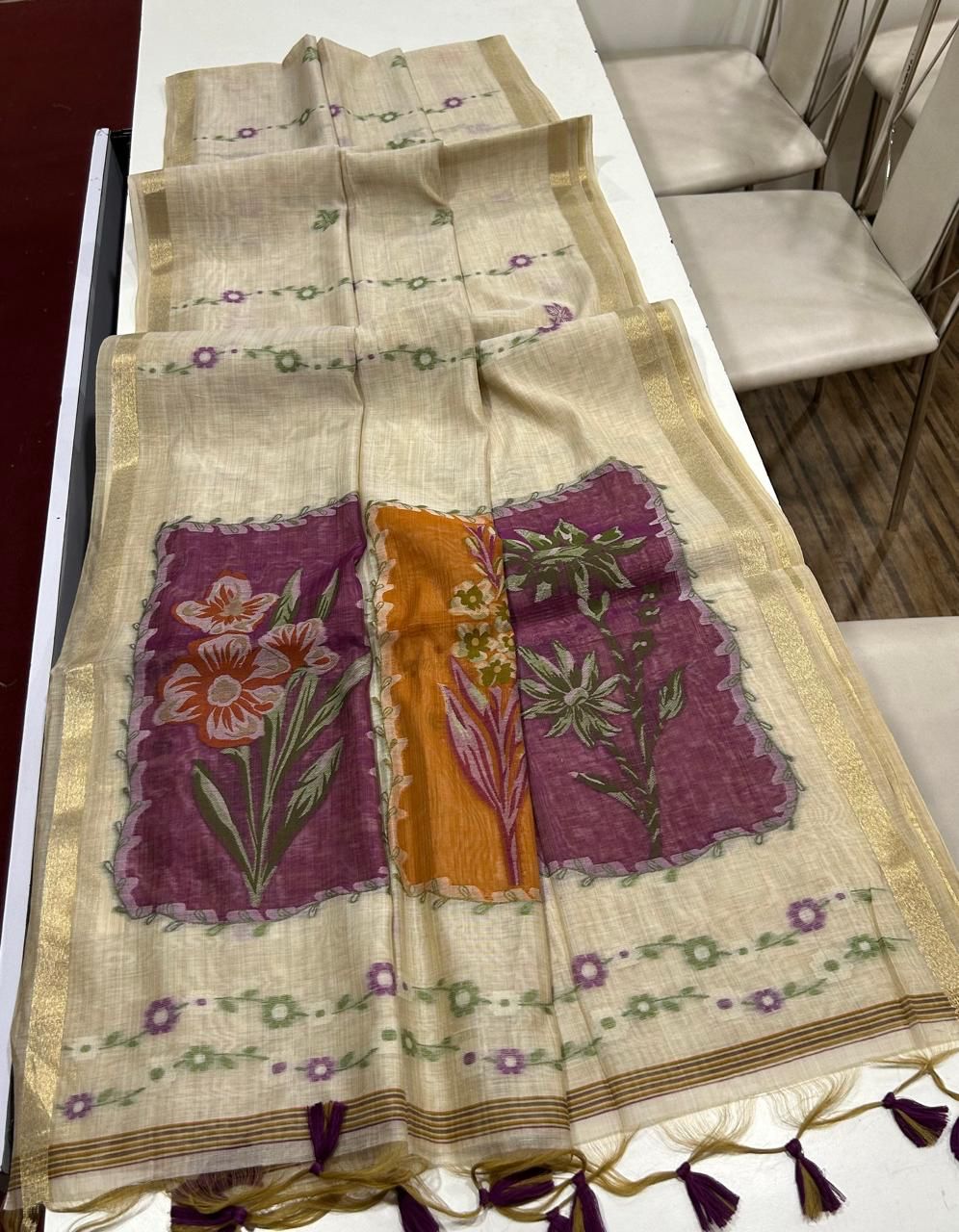 Premium muga cotton saree with multi colour flower weaving pallu