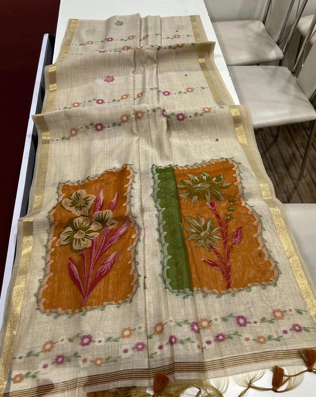 Premium muga cotton saree with multi colour flower weaving pallu